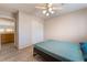 Clean bedroom with wood-look flooring, a ceiling fan and a closet at 2874 Avanti Ln, Henderson, NV 89074
