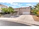 Charming two-story home featuring a well-maintained front yard and a spacious driveway at 2874 Avanti Ln, Henderson, NV 89074