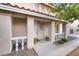 Inviting front porch with decorative columns and potted plants at the entrance at 2874 Avanti Ln, Henderson, NV 89074