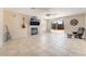 Bright living room with fireplace, guitars, ceiling fan, and sliding door to the backyard at 2874 Avanti Ln, Henderson, NV 89074