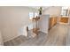 Staircase with light-colored vinyl floors and wood railing leads to the upstairs level at 2874 Avanti Ln, Henderson, NV 89074