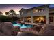 Home exterior showcasing a large backyard pool, patio, and balcony at 3042 Hammerwood Dr, Las Vegas, NV 89135