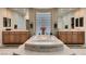 Beautiful bathroom featuring a soaking tub, dual sinks, and natural light at 3042 Hammerwood Dr, Las Vegas, NV 89135