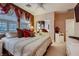 Bedroom featuring soft lighting, neutral tones, and tasteful accents, with a plush comforter set and ample storage at 3042 Hammerwood Dr, Las Vegas, NV 89135