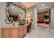 Welcoming entryway with decorative mirror, desk, and views into other rooms at 3042 Hammerwood Dr, Las Vegas, NV 89135