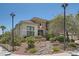 Charming two-story home featuring a stone facade, landscaped front yard, and inviting curb appeal at 3042 Hammerwood Dr, Las Vegas, NV 89135