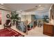 Spacious landing featuring wrought iron railing, comfortable seating, and stylish decor, providing a welcoming transition at 3042 Hammerwood Dr, Las Vegas, NV 89135