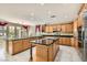 Gourmet kitchen with custom cabinetry, granite countertops, and stainless steel appliances at 3042 Hammerwood Dr, Las Vegas, NV 89135