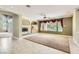Inviting living room with a fireplace, built-in shelving, and large windows offering natural light at 3042 Hammerwood Dr, Las Vegas, NV 89135