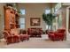 Inviting living room with plush seating, large windows, and elegant decor at 3042 Hammerwood Dr, Las Vegas, NV 89135