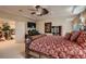 Spacious main bedroom with a decorative ceiling fan, elegant furniture, and plenty of natural light at 3042 Hammerwood Dr, Las Vegas, NV 89135