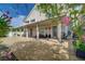 Back of the house with covered patio, pillars, and views of the yard at 3192 Tullio Way, Henderson, NV 89052