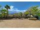 Relaxing backyard space with a tiled patio, blooming flowers, and well-maintained landscaping at 3192 Tullio Way, Henderson, NV 89052