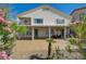 Back of the house with covered patio, pillars, balcony and views of the yard at 3192 Tullio Way, Henderson, NV 89052