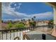 Balcony offering panoramic views of the surrounding neighborhood with palm trees at 3192 Tullio Way, Henderson, NV 89052