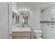 Bathroom featuring a vanity with marble countertop and glass-enclosed shower at 3192 Tullio Way, Henderson, NV 89052