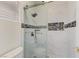 Glass enclosed shower with modern tile in bathroom at 3192 Tullio Way, Henderson, NV 89052