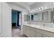 Bathroom with double sinks and view into the bedroom at 3192 Tullio Way, Henderson, NV 89052