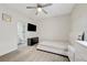 Bright bedroom featuring an ensuite bathroom, ceiling fan, and neutral color scheme at 3192 Tullio Way, Henderson, NV 89052