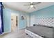 Light blue bedroom with a silver bed frame and gray accents at 3192 Tullio Way, Henderson, NV 89052