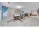 Bright dining room with tile floor, statement art, and fireplace at 3192 Tullio Way, Henderson, NV 89052