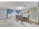 Dining area with stylish lighting, tile floors and designer curtains at 3192 Tullio Way, Henderson, NV 89052