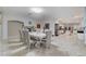 Formal dining room features tile floors, ornate table, and neutral decor at 3192 Tullio Way, Henderson, NV 89052