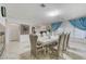 Dining room features a decorative chandelier, tile floors, and large table at 3192 Tullio Way, Henderson, NV 89052