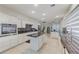 Modern kitchen features granite countertops, white cabinetry, and island at 3192 Tullio Way, Henderson, NV 89052