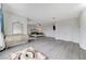 Spacious main bedroom with large walk in closet, grey wood-look floors and decorative curtains at 3192 Tullio Way, Henderson, NV 89052
