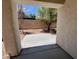 View of the backyard enclosed by block fence at 3261 Monaco Shores Dr, Las Vegas, NV 89117