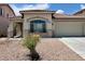 Charming exterior with a red roof and two-car garage at 3261 Monaco Shores Dr, Las Vegas, NV 89117