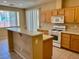 The kitchen features tile floors, wood cabinets, and white appliances at 3261 Monaco Shores Dr, Las Vegas, NV 89117