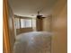 Main bedroom with a ceiling fan, a large window, and no floor covering at 3261 Monaco Shores Dr, Las Vegas, NV 89117