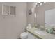 Well-lit half bathroom with a modern sink and toilet at 3659 Gerri Bay Ln, Las Vegas, NV 89147