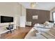 Spacious bedroom with two beds, wooden floor, desk and chair and a dark accent wall at 3659 Gerri Bay Ln, Las Vegas, NV 89147