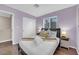 Cozy bedroom with a comfortable bed, closet, and natural light from the windows at 3659 Gerri Bay Ln, Las Vegas, NV 89147