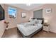 Cozy bedroom with a comfortable bed, neutral decor, and ample natural light from the large window at 3659 Gerri Bay Ln, Las Vegas, NV 89147