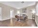 Bright dining room with a large table, seating for eight and modern décor at 3659 Gerri Bay Ln, Las Vegas, NV 89147