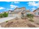 Charming two-story home featuring desert landscaping, a tile roof, and an attached two-car garage at 3659 Gerri Bay Ln, Las Vegas, NV 89147
