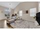 Spacious living room with high ceilings, modern lighting, and neutral color palette at 3659 Gerri Bay Ln, Las Vegas, NV 89147