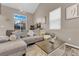 Bright living room with many windows, comfortable seating, and a neutral color palette at 3659 Gerri Bay Ln, Las Vegas, NV 89147