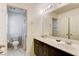 Neutral-toned bathroom featuring large vanity, toilet, and walk-in shower at 3839 Zodiacal Light St, Las Vegas, NV 89129