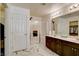 Modern bathroom boasts double sinks, a glass-enclosed shower, and a walk-in closet at 3839 Zodiacal Light St, Las Vegas, NV 89129