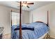 Comfortable bedroom featuring a four-poster bed, soft lighting, and neutral tones at 3839 Zodiacal Light St, Las Vegas, NV 89129