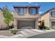 Charming two-story home with a two-car garage and desert landscaping at 3839 Zodiacal Light St, Las Vegas, NV 89129