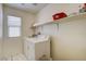 Laundry room features a washing machine, dryer, marble floor, and shelving for efficient organization at 3839 Zodiacal Light St, Las Vegas, NV 89129