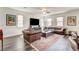 Bright and inviting living room with leather furniture and a decorative rug at 3839 Zodiacal Light St, Las Vegas, NV 89129