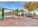 Community playground featuring swings, slides, and climbing structure, perfect for recreation and fun at 3839 Zodiacal Light St, Las Vegas, NV 89129