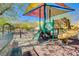 Community playground with colorful shade structure, slides, and climbing features for enjoyment at 3839 Zodiacal Light St, Las Vegas, NV 89129
